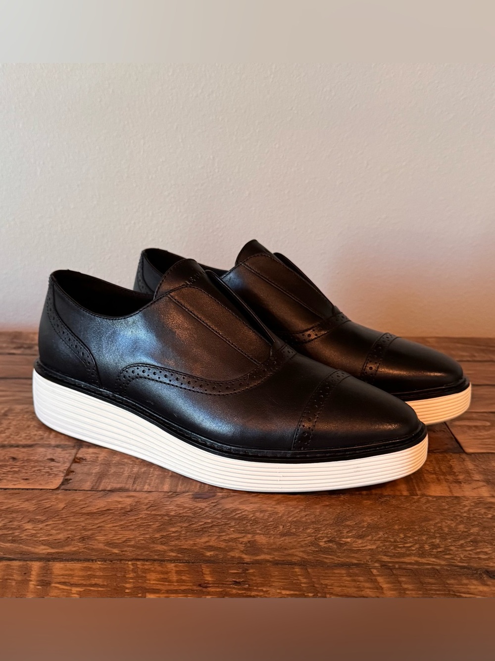 Cole Haan Black Leather Slip-On Wingtip Sneakers with White Platform Sole